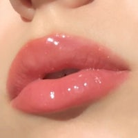 a close up of a woman's pink lips